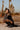 Model wearing silver jewellery by Azadi Adornments in a desert setting