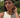 Woman wearing gold set jewelry choker and bangle combination